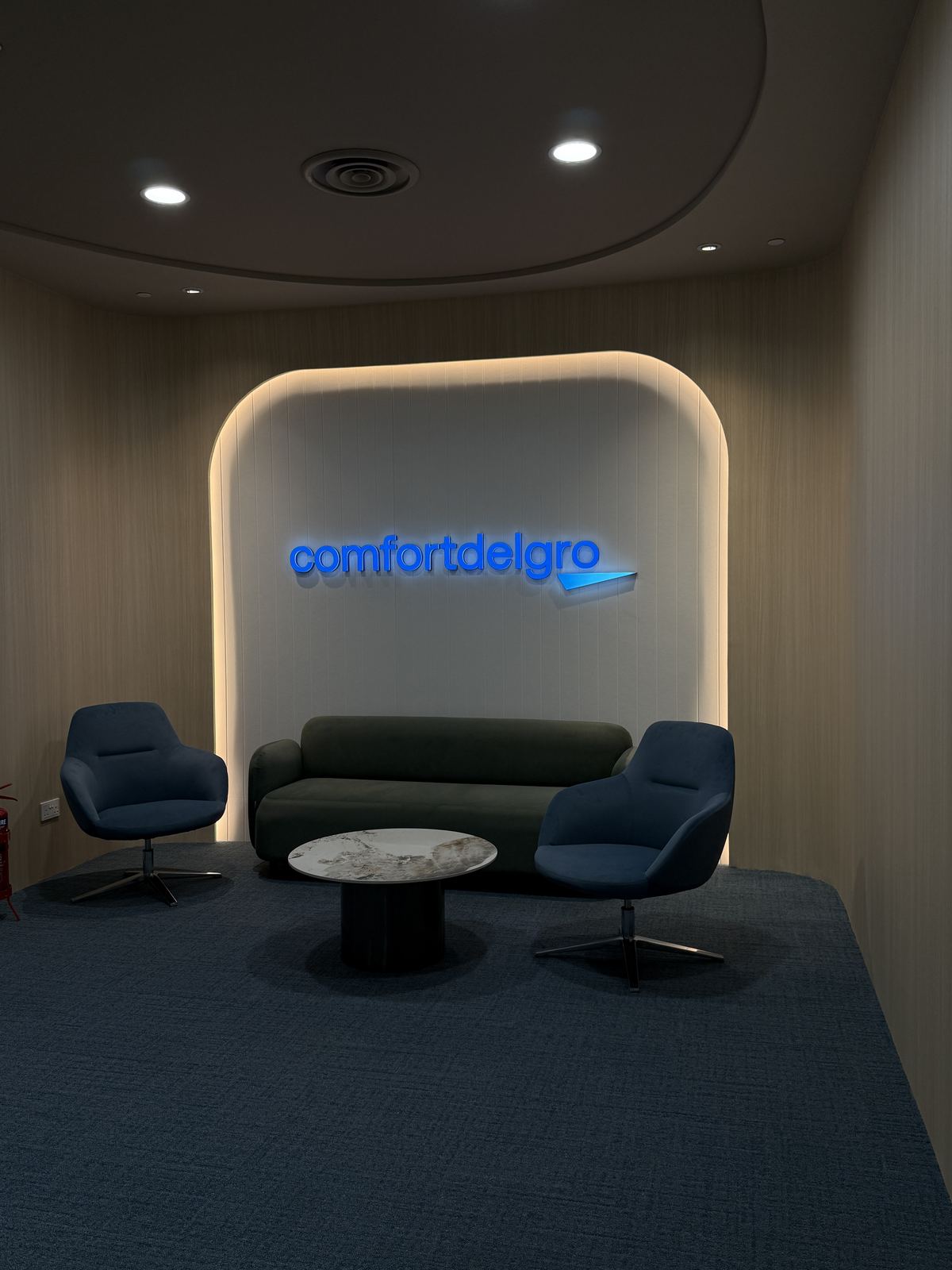 ComfortDelGro — front-lit arch logo · lounge
