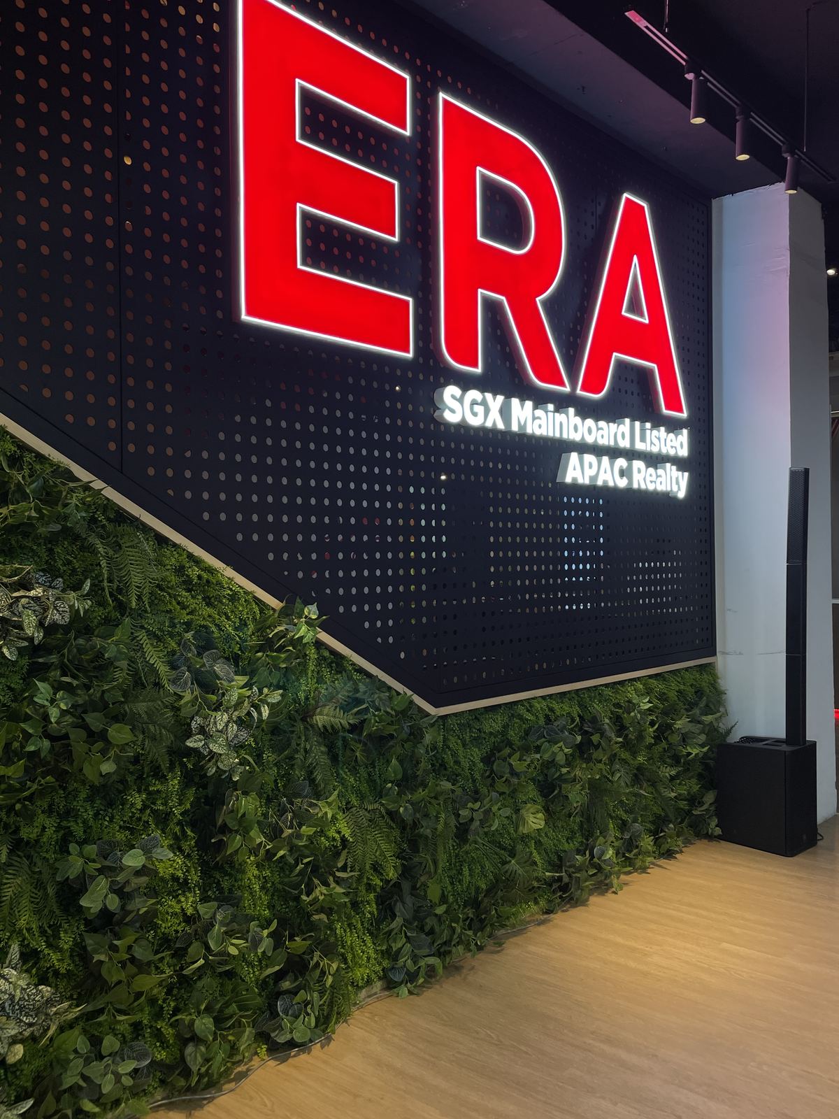ERA — sgx-listed lettering · green wall