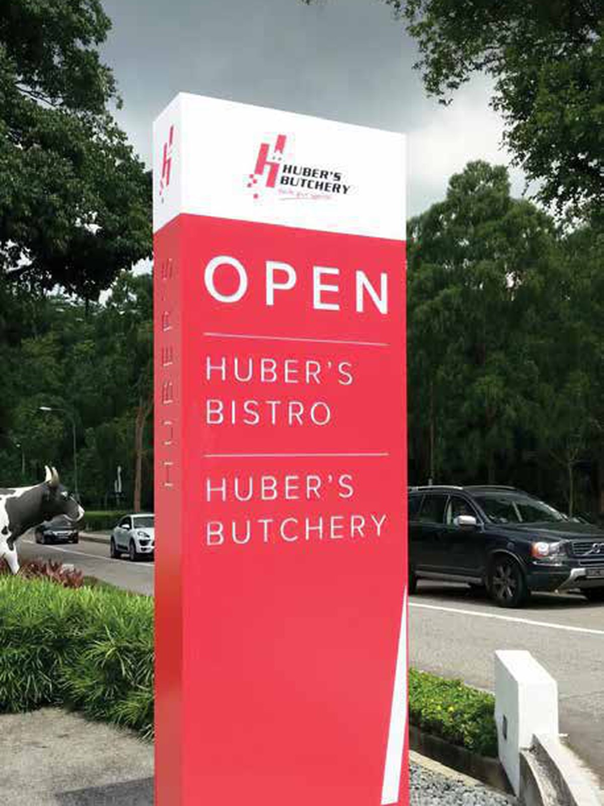 Huber’s Butchery · Dempsey — pylon sign